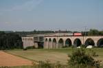 Swiss-Express Re 4/4  zieht ihren IR 2587 Schaffhausen - Zrich HB ber die Rheinbrcke bei Eglisau.