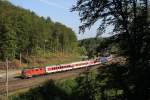 Re4/4 11214 passiert mit Nachtzug 458 den Bahnhof Zeihen, 28.06.2012.