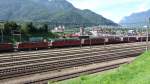 16 roten Re 6/6, Re 4/4 II, Re 620 cargo und eine Re 6/6 noch in güner Farbgebung in Reih und Glied, Güterbahnhof Bellinzona S. Paolo (16-08-2012)
