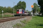 Auf der Fahrt von Mnchen nach Zrich zieht Re 421 383-1 die in Lindau bernommenen Wagen des EC 196 am 11.09.2016 am Einfahrvorsignal von Lindau-Reutin vorbei.