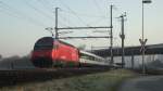 Die Re 460 079-7  Weissenstein  ist am 23.03.2012 zwischen Nebikon und Dagmersellen mit dem Schieben eines IR nach Basel beschftigt.