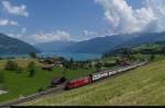 Am 7. Mai 2015 fhrt IC 974 Interlaken Ost-Basel SBB durch Faulensee am Thunersee.