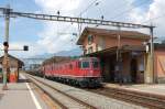 Re 6/6 11667 und Re 4/4 mit einem Kesselwagenzug am 29.06.2009 in Bex