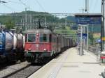 SBB - Statt IR nach Zrich - Chur kommt die Re 6/6 11685 und Re 4/4 mit Gterzug bei der durchfahrt im Bahnhof Liestal am 15.06.2012