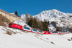 Am Ortsrand von Andermatt konnte am 10.02.2023 HGe 4/4 II mit der Nummer 104 mit dem Glacier Express PE 923 von St. Moritz nach Zermatt fotografiert werden. 