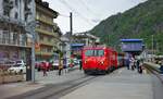 Am trüben Morgen des 06.05.2024 fährt HGe 4/4 II 109 mit dem Panorama-Express nach St.