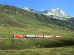 MGB exFO GLACIE-EXPRESS F 901 von Chur nach Zermatt am 24.08.1997 oberhalb Ntschen mit E-Lok HGe 4/4II 108 - RhB WR 3812 - Br 4293 - B 4263 - PS 4011.
