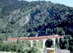 MGB exFO GLACIE-EXPRESS A 10902 (bis 22.05.1993) von Zermatt nach Chur am 22.05.1993 auf Grengiols-Viadukt mit E-Lok HGe 4/4II 104 - B - RhB B - RhB B -RhB B - ABt.