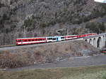 Die Gepäcktriebwagen Deh 4/4 53 (ex-FO) im  sandwich  mit ein Regiozug von Andermatt nach Brig, hier uber die viadukt Grengiols, 01-02-2016