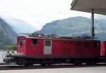 Im Bahnhof Disentis-Mustr ist historisches Lok HGe 4/4 36 der MGB (es steht noch FO auf der lok) gerade angekommen aus die richtung Zermatt-Brig-Andermatt.