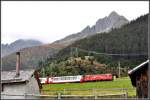 GlacierExpress 902 mit Hge 4/4 II 103 bei Sedrun. (25.09.2012)