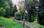 TW 182 plus ein einzelner Wagen mit Fahrgästen darauf war am 18.05.1986 auf der Museumsbahn Blonay-Chamby unterwegs.