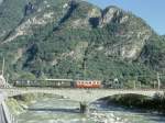 FM Dampfextrazug fr GRAUBNDEN TOURS V3215 von Cama nach Castione-Arbedo vom 29.08.1997 auf der Moesabrcke bei Roveredo mit Dampflok G 3/4 1 - B 21 - B 2060 - A 1102. Hinweis: der Lschzug folgte in kurzen Sichtabstand