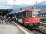 9-teiliger NPZ Pendel (mit Re 4/4 II 11226) als EXT 10561 Zrich-Chur im Bahnhof Landquart, 04.09.2010.