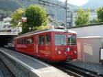 RB - Im Bahnhof Vitznau ein Gterzug mit dem Triebwagen Bhe 2/4 5 und Gterwagen FU 1 sowie einem Flachwagen unterwegs am 07.09.2009