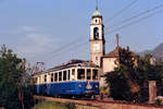 FERROVIE AUTOLINEE REGIONALI TICINESI.
CENTOVALLIBAHN/FART.
Regionalzug Camedao-Locarno bestehend aus einem ABDe 6/6 31-32 im Mai 1987 vor der imposanten Kulisse der Chiesa de Tegna.
Foto: Walter Ruetsch