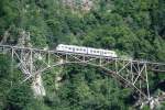 FART Centovalli-Bahn 1.Klasse-REGIONALZUG 327 von Camedo nach Locarno am 07.06.1995 bei Camedo auf Ponte Ruinacci mit Ae 4/6 58.