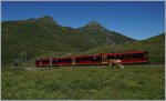 Der Jungfraubahn JB Beh 4/8 221 auf Bergfahrt oberhalb der Kleinen Scheidegg.
8. August 2016