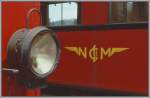 Logo und Stirnbeleuchtung an den alten Triebwagen der Nyon - St-Cergue - Morez (NStCM) Bahn.