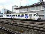 tpf - Steuerwagen mit Werbung ABt 50 36 35-33 383-7 in Fribourg am 01.03.2014