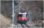 RE1236 nach Disentis mit Ge 4/4 II 620  Zernez  hat bei Reichenau soeben den Vorderrhein berquert. (13.02.2011)