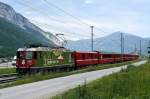 Der Regio nach Disentis mit der neuen Jubilums-Lok, der Ge 4/4 630   100 Jahre Chur-Diesentis , bei Reichenau am 7.6.2012. Schade, dass die Sonne gerade hinter Wolken verschwunden war, aber sie fhrt ja noch lnger in dieser schnen Bemalung.Das grosse Fest steigt am 16./17. Juni 2012 in Disentis/Mustr, also nichts wie hin.