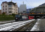 RhB - Ge 4/4 648 vor Schnellzug beim verlassen des Bhf.