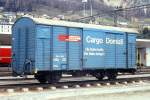 RhB - Gbk-v 5522 am 09.05.1991 in Samedan - Gedeckter Gterwagen 2-achsig mit 1 offenen Plattform CARGO DOMIZIL - Baujahr 1911 - LOUV/RhB - Gewicht 6,58t - Zuladung 12,50t - LP 8,49m - zulssige Geschwindigkeit Aufkleber 70 km/h - 2=26.03.1987 - Beschriftung: deutsch - Lebenslauf: ex K1 5522 - 1969 Gbk 5522 - 1971a - 1973 Gbk-v 5522 - 01/2006 Abbruch - Hinweis: noch alte Zuladung,  gescanntes Dia
