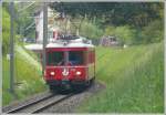 S1 1520 mit Be 4/4 512 kommt bei Farsch zwischen Bonaduz und Reichenau-Tamins durch diesen markanten Einschnitt. (18.05.2010)
