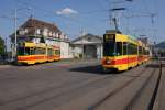 Be 4/8 206 verlässt die Haltestelle MParc mit Be 4/6 203 in Richtung Flüh (Rodersdorf war wegen Bauarbeiten gesperrt) während Be 4/8 238 vor dem Depot Dreispitz wartet um ihm in wenigen