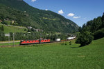 Re 6/6 11634 und Re 4/4 II 11272 mit einem Güterzug am 19.07.2016 bei Rodi-Fiesso.