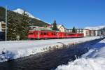 Auf einem Skizug Umlauf Davos-Klosters war heute ein Stammnetzpendel im neuen Farbkleid im Einsatz. Be 4/4 514 mit B und ABt bei Davos Platz, 31.12.2013.