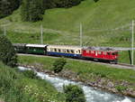 Die Ge 4-4 I 602 mit ein historische Zug von Davos Platz nach Filisur.
Hier, zwischen Davos Frauenkirch und Davos Glaris, 19/06/2018