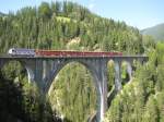 650	(Seewis im Prttigau/Eigenwerbung Unesco Weltkulturerbe) mit einem Regionalzug auf dem Wiesener Viadukt am 19. August 2009.