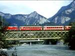 RhB Schnellzug GLACIER-EXPRESS H 905 von St.Moritz nach Zermatt vom 02.09.1997 auf Rheinbrcke bei Reichenau mit E-Lok Ge 4/4II 613 - B 2445 - FO B 4287 - A 1263 - B 2428 - FO PS 4012 - B 2430 - FO B