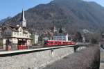 Regio von Arosa kommend,kurz vor der Haltestelle Chur-Stadt.Links die Martinskirche.07.03.11