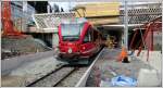 ABe 8/12 3507 rangiert so gut es geht im halbfertigen Bahnhof Arosa.