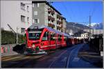 R1429 mit Allegra 3511 auf der Engadinstrasse mit Bahnhof Chur und dem Falknis im Hintergrund.