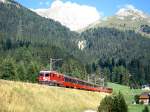RhB Schnellzug BERNINA-EXPRESS D 500 von Tirano nach Chur am 06.09.1994 bei Naz kurz unterhalb Preda mit E-Lok Ge 4/4II 627 und EW-IV-Kompo. Hinweis: Strecke ist hier inzwischen auf Doppelpur ausgebaut! 