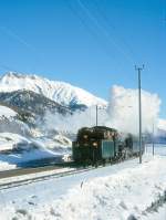 RhB Dienst-Dampfzug 9732 von Samedan nach St.Moritz am 09.02.1997 Einfahrt Celerina mit Dampflok Tender voraus G 4/5 108 - B 2245 - A 1102 - B 2060 - D 4052I. Hinweis: gescanntes Dia
