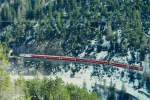 RhB Schnellzug 544 von St.Moritz nach Chur am 03.03.1998 kurz vor Fuegna-Tunnel zwischen Preda und Muot mit E-Lok Ge 4/4III 643 - B - A 1230 - A 1240 - B 2395 - B 2430 - B 2428 - D 4220. Hinweis: gescanntes Dia
