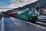 Die für A&M AG werbende Ge 4/4 III 647  Grüsch  fährt mit dem R 1172 (St. Moritz - Filisur - Chur), aus dem Bahnhof Samedan aus.
Aufgenommen am 21.7.2016.