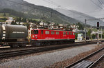 Ge 6/6 II 703  St. Moritz  steht mit einem Mischer in Richtung Chur, im Bahnhof Samedan.
Aufgenommen am 21.7.2016.