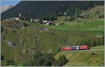 Die RhB Ge 6/6 II 703  St.Moritz  hat auf ihrer Fahrt mit dem Alubla Schnellzug RE 1148 die mittlere Ebene oberhalb von Bergün erreicht. Im Hintergrund ist das Heidi (Film)-Dorf Latsch zu erkennen. 
14. Sept. 2016