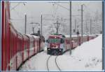 RE1133 wartet in Sils im Domleschg auf den RE1132 aus St.Moritz mit Ge 4/4 III 650  Seewis-Valzeina , (01.12.2009)
