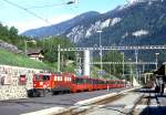 RhB Schnellzug BERNINA-EXPRESS D 500 von Tirano nach Chur am 15.05.1994 in Tiefencastel mit E-Lok Ge 6/6II 707 und EW-IV-Kompo.