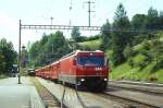 RhB Schnellzug 551 von Chur nach St.Moritz am 27.06.1995 Einfahrt Filisur mit E-Lok Ge 4/4 III 644 - D 4219 - B 2345 - B 2442 - B 2449 - A 1232 - A 1223 - B 2330.