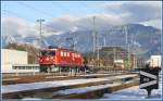 Ge 6/6 II 706  Disentis/Mustr  mit Gterzug in Ems Werk.