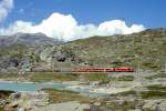 RhB GmP 4435 von St.Moritz nach Tirano am 04.09.1997 am Sdende des Lago Bianco mit Zweikraftlok Gem 4/4 802 - Triebwagen ABe 4/4III 56 - B 2313 - Rw 8290 - Kk 7361 - Kk 7346 - Kk 7345 - Kk 7351 -