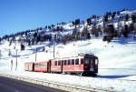 RhB REGIONALZUG 434 von Tirano nach St.Moritz am 10.03.1998 oberhalb Bernina Suot mit Triebwagen ABe 4/4II 43 - B 2233 - DZ 4036.